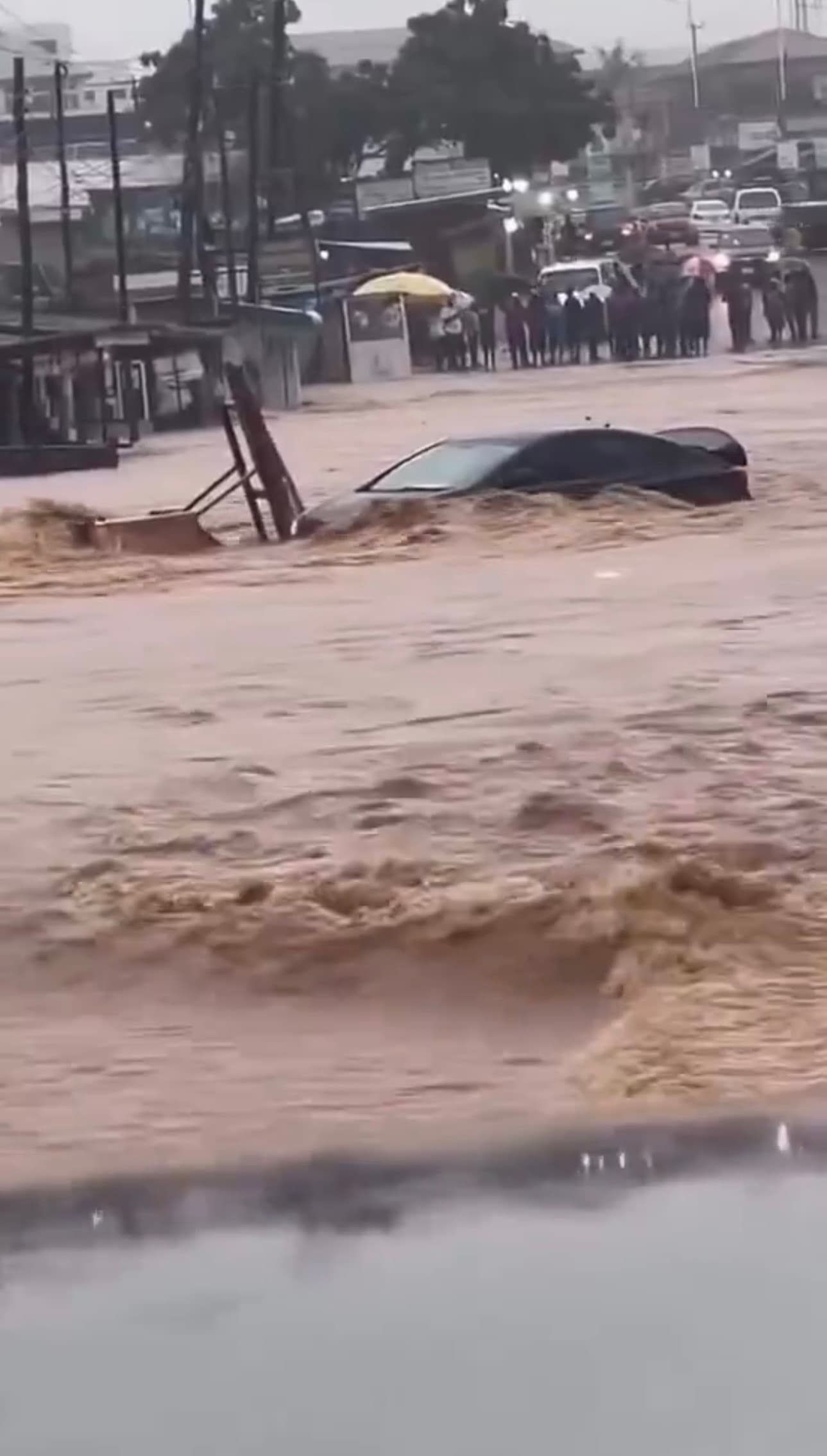 Motorist Trapped in Floodwaters at Taifa Junction as Heavy Rains Batter Accra